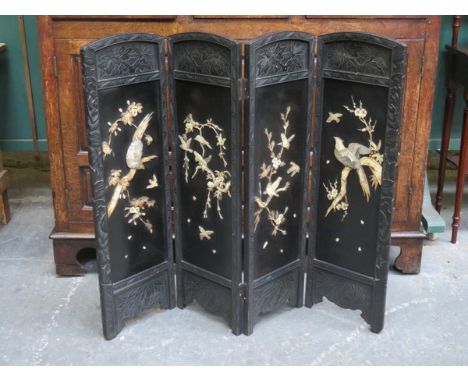 JAPANESE CARVED AND BLACK LACQUERED FOUR FOLD SCREEN WITH MOTHER OF PEARL DECORATION  
