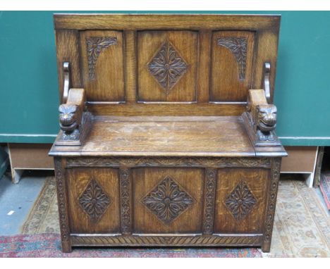 HEAVILY CARVED OAK MONKS BENCH WITH LIFT UP SEAT 