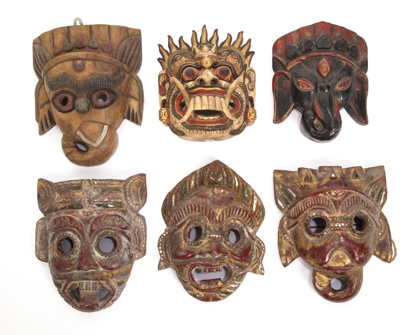 GROUP OF SIX CARVED WOODEN MASKS Painted Asian animal masks, some with ...