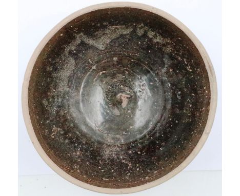 A Song Dynasty large glazed clay bowl, D: 15 cm, H: 7 cm. P&P Group 2 (£18+VAT for the first lot and £3+VAT for subsequent lo