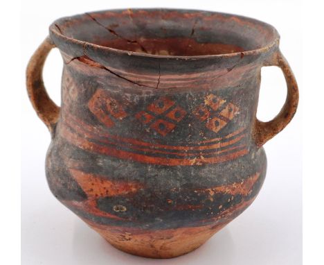 A Neolithic period painted terracotta twin handled pot, decorated with geometric designs, painted mark to the base, repaired 