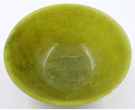 A Chinese carved jade or similar bowl, D: 12 cm, H: 5 cm. Small chip to rim. P&P Group 2 (£18+VAT for the first lot and £3+VA