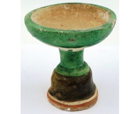 A Ming dynasty glazed white clay pedestal, having a bowl form top supported on a shaped stand, some loss of glaze, D: 11 cm, 