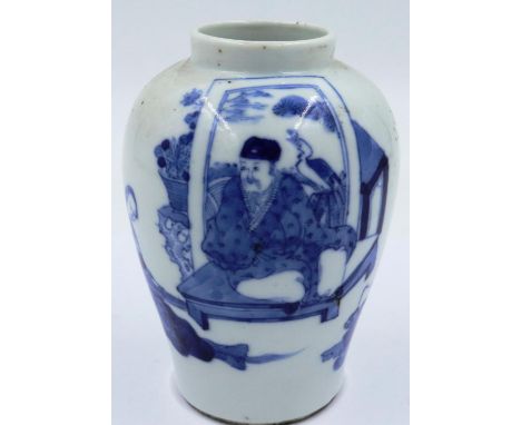 A Kangxi glazed baluster form jar of diminutive proportions, simply decorated in blue of two seated figures and pagoda agains