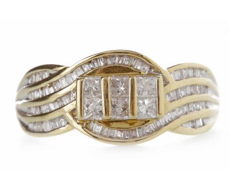 NINE CARAT GOLD DIAMOND DRESS RINGthe bezel formed by three oval sections with waved rows of channel set taper cut diamonds, 