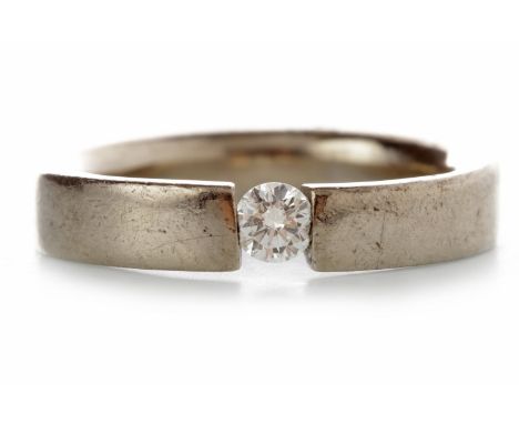 DIAMOND SET BANDwith a single tension set round brilliant cut diamond of approximately 0.12 carats, unmarked, size K, 7.3g