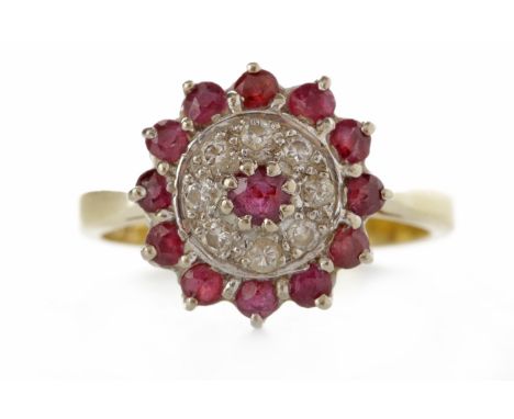 EIGHTEEN CARAT GOLD RUBY AND DIAMOND DRESS RINGthe round bezel 12.5mm diameter and set with a central round ruby and a with a