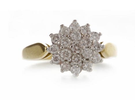 EIGHTEEN CARAT GOLD DIAMOND CLUSTER RINGthe snowflake bezel 10.5mm diameter and set with round diamonds, size K, 3.8g
