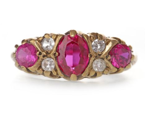 NINE CARAT GOLD CREATED RUBY AND WHITE GEM SET RINGin the Victorian style, set with three graduated created rubies interspace