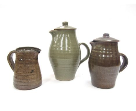 Two Leach St Ives Pottery coffee pots and lids plus a cream jug, various glazes, impressed seals. Tallest 24cm 