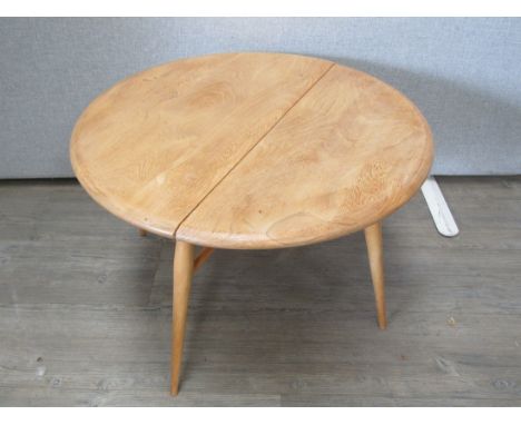 An Ercol light elm finish drop leaf occasional table. 41cm high x 61cm extended 