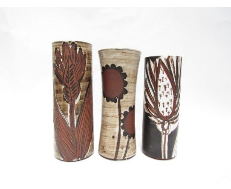 Briglin Pottery - Three cylindrical vases, each with incised and wax resist foliate detail. Impressed marks. Tallest 26.5cm. 