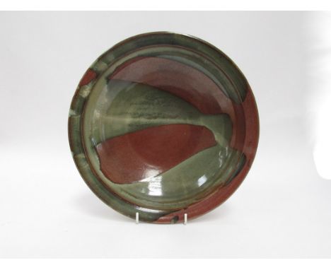 RAY FINCH (1914-2012) A Winchcombe Pottery bowl, brown glaze with poured green slip detail. Impressed seal. 27.5cm diameter x