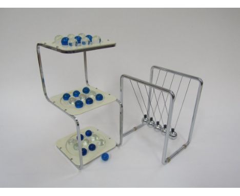 A Newtons cradle executive toy and a 3D multi level checkers stand with glass marbles 