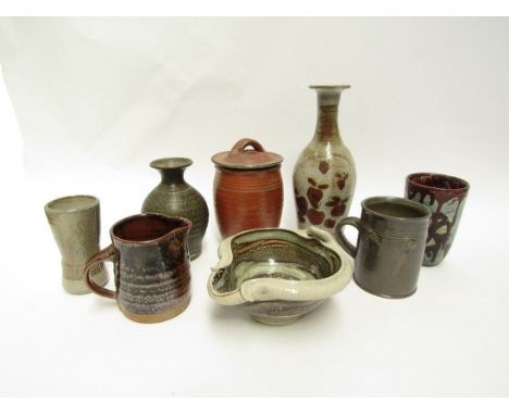 A collection of eight small studio pottery items including Winchcombe bud vase etc. Tallest 22cm (some a/f) 