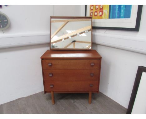 A Mid 20th Century teak dressing chest with mirror above. Chest 76cm x 43cm x 73cm high, total height   124cm 