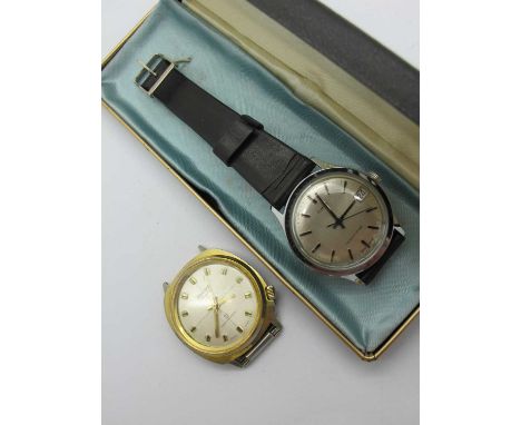 Timex; A Vintage Gent's Wristwatch, the signed dial with line markers, centre seconds and date aperture, on a strap, in origi