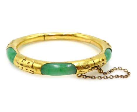 19th century Chinese gold and jade hinged bangle, with character marks embossed around the gold exterior, stamped 22 PG  Cond