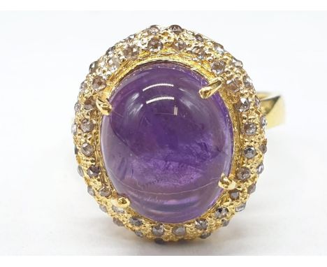 5.50 Cts Amethyst set within a gold plated ring, with 0.45 Cts Rose cut diamonds, weight 4.9g and size L1/2 