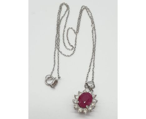 Ruby and Diamond PENDANT on a 18ct Gold CHAIN and setting. 2.7g 38cm