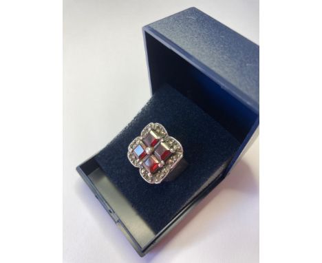 Vintage silver ring having four stones to top, test as tourmaline. Marcasite surround. Full hallmark. Size K/L. 