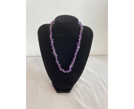 Amethyst necklace with pieces of amethyst mounted on elasticated twine. 45-50cm approx. 