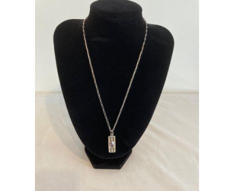 Silver Rennie Mackintosh designed pendant having centre amethyst and mounted on a silver chain. Silver chain having modernist