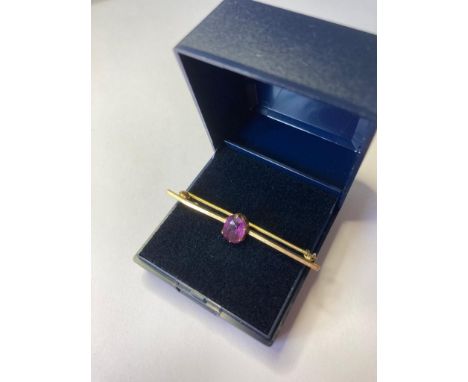 9ct gold and amethyst bar brooch. As found. 4.75cm in length. 1.9 grams in weight. 