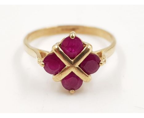 A 9ct gold ring with four ruby stones. 2.3g total weight and is size P. 