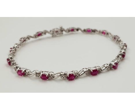 A ruby and diamond ladies bracelet on 9ct white gold. 6.2g total weight and 19cm long. 