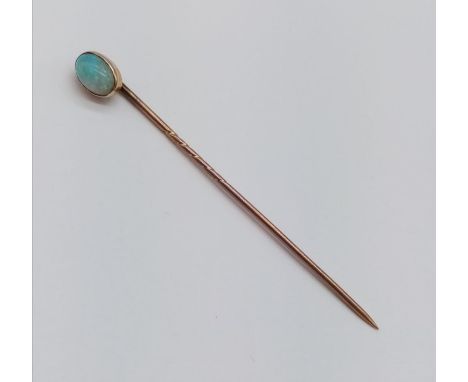 Vintage yellow metal stick pin with opal head , 7cm long 