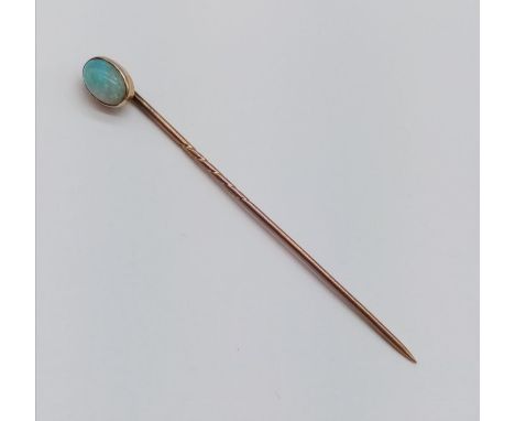 Vintage yellow metal stick pin with opal head , 7cm long 