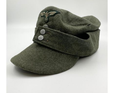 Ersatz (economy issue) Waffen SS M43 Cap. This is a standard Heer (Army) cap that has a panzer collar skull covering the roun