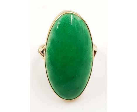 A 9ct gold, almost emperor ming-like jade ring. 7.2g total weight. 