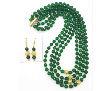 A four row green jade necklace with Chinese gilded central beads and assorted Earrings. Necklace length: 56-63cm, earrings le