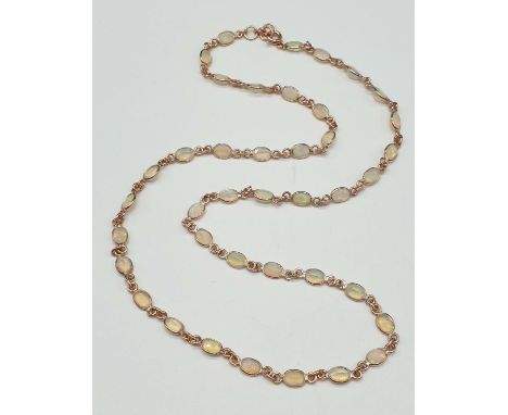 A Ethiopian Opal Necklace in Sterling Silver rose Gold finish. Necklace length 28cm, weight 11.16 grams. 