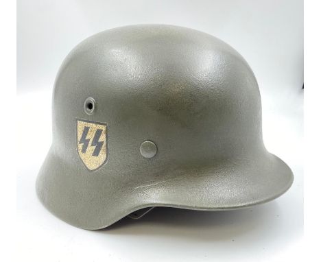 WW2 German Hand Rendered Single Decal Waffen SS M40 Helmet. Stamped Q64 for the Quist factory in Esslingen, Germany. 