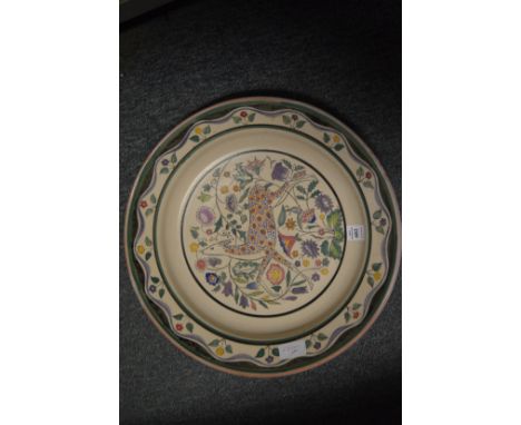 A good early Poole pottery circular dish decorated with a stylised deer.