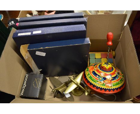 A tin plate child's spinning top, model brass aeroplanes and other items.