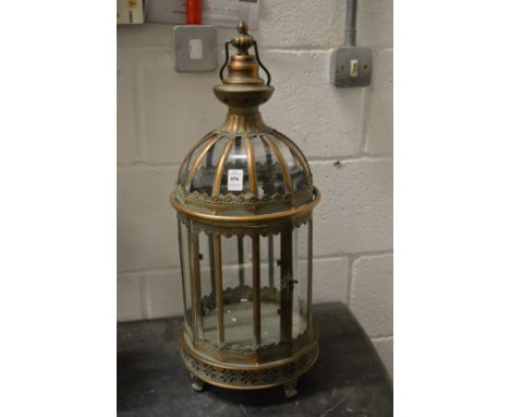 An ornate metal candle lantern.