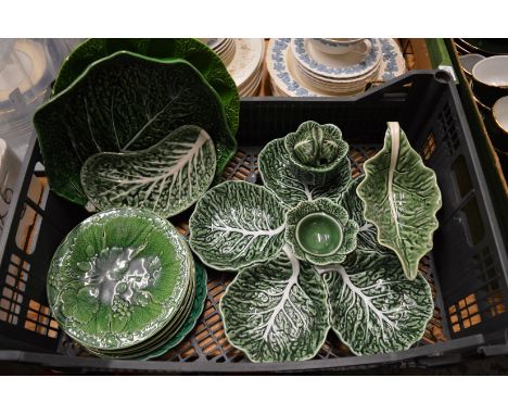 A quantity of cabbage leaf plates and serving dishes.