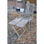 A carved hardwood rocking chair and a folding table.