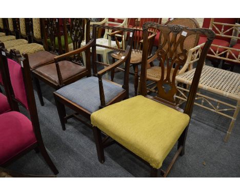 A 19th century mahogany dining chair with arms together with a Chippendale style mahogany dining chair.