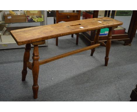 A fruit wood bench seat.