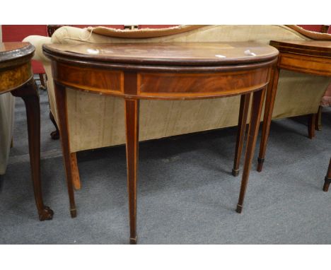 A George III mahogany and satinwood banded fold-over card table.