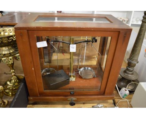 A mahogany cased scientific scales.