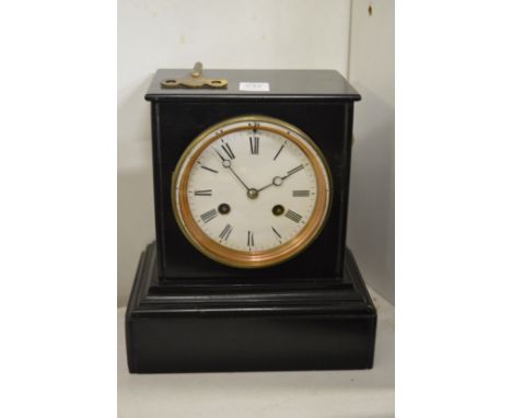 A Victorian slate mantel clock.