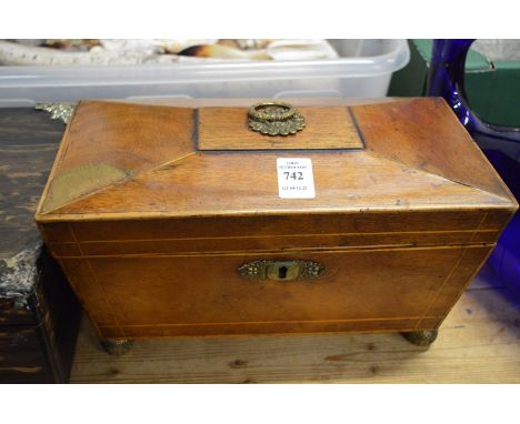 A Victorian mahogany sarcophagus shaped tea caddy.