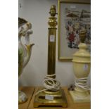A brass table lamp.
