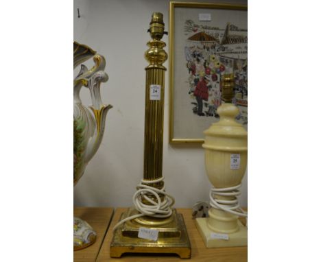 A brass table lamp.